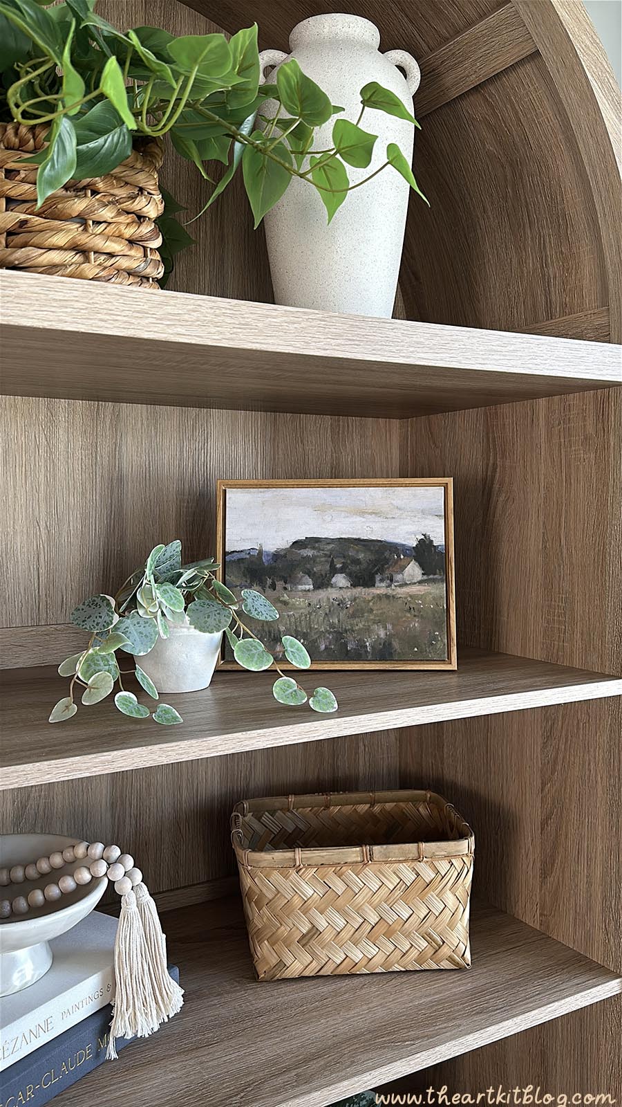 SICOTAS arched cabinet bookshelf styled with books and décor